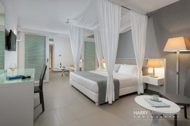 junior-suite-sharing-pool-sea-view-bedroom-1a-380x253 Princess Andriana. Ασύγκριτη πολυτέλεια και εξαιρετική άνεση! - Φωτογράφιση Ξενοδοχείων Χάρης Ζαμπετούλας 